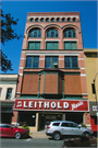 116 S 4TH ST, a Romanesque Revival large retail building, built in La Crosse, Wisconsin in 1884.