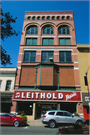 116 S 4TH ST, a Romanesque Revival retail building, built in La Crosse, Wisconsin in 1884.