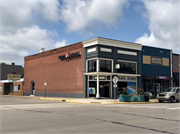 255 S KNOWLES AVE, a Commercial Vernacular small retail building, built in New Richmond, Wisconsin in 1912.
