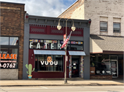121 S KNOWLES AVE, a Commercial Vernacular small retail building, built in New Richmond, Wisconsin in 1906.