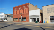 214 S MAIN ST, a Commercial Vernacular large retail building, built in Shawano, Wisconsin in 1903.