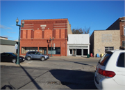 214 S MAIN ST, a Commercial Vernacular large retail building, built in Shawano, Wisconsin in 1903.