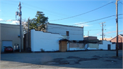 214 S MAIN ST, a Commercial Vernacular large retail building, built in Shawano, Wisconsin in 1903.