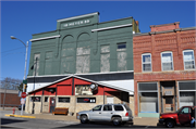1544-1546 COMMERCIAL ST, a Romanesque Revival theater/opera house/concert hall, built in Bangor, Wisconsin in 1899.