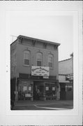 210 N 8th St, a Italianate small retail building, built in Manitowoc, Wisconsin in 1900.