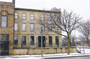 607-609 W VIRGINIA ST, a Federal row house, built in Milwaukee, Wisconsin in 1850.