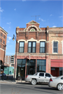 401 S 3RD ST, a Romanesque Revival grocery store/supermarket, built in La Crosse, Wisconsin in 1884.