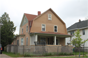 607 - 609 N MAPLE AVE, a Dutch Colonial Revival duplex/two-flat, built in Green Bay, Wisconsin in 1909.