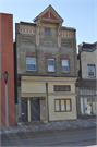 1027 W NATIONAL AVE, a Queen Anne small retail building, built in Milwaukee, Wisconsin in 1885.