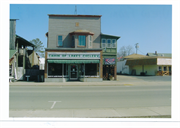 107 N RAILROAD ST, a Commercial Vernacular small retail building, built in Eagle River, Wisconsin in 1888.