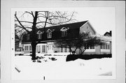 1404 MICHIGAN AVE, a Dutch Colonial Revival house, built in Manitowoc, Wisconsin in 1905.