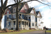 W1901 USH 16, S SIDE USH 16, OPPOSITE INTERS W/ STATE HIGHWAY 146, a Queen Anne house, built in Fountain Prairie, Wisconsin in 1900.