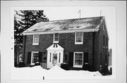 907 PINE ST, a Colonial Revival/Georgian Revival house, built in Manitowoc, Wisconsin in 1941.