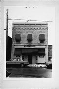 807 QUAY ST, a Italianate small retail building, built in Manitowoc, Wisconsin in 1868.
