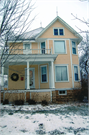 225 N MONROE ST, a Queen Anne house, built in Stoughton, Wisconsin in 1904.