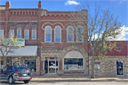 126 S EAU CLAIRE ST, a Romanesque Revival bank/financial institution, built in Mondovi, Wisconsin in 1891.