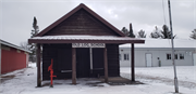 N9130 FOREST LN  (AKA PRICE CO FAIRGROUNDS OFF COUNTY HIGHWAY H, 1 MI E OF PHILLIPS), a Front Gabled one to six room school, built in Phillips, Wisconsin in 1887.