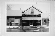 1112 WASHINGTON ST, a Front Gabled small retail building, built in Manitowoc, Wisconsin in 1867.