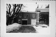 1409-1409A WASHINGTON ST, a Queen Anne carriage house, built in Manitowoc, Wisconsin in 1911.