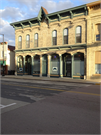 114-118 N LUDINGTON, a Early Gothic Revival large retail building, built in Columbus, Wisconsin in 1877.