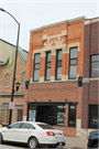 217 N WASHINGTON ST, a Commercial Vernacular small retail building, built in Green Bay, Wisconsin in 1882.