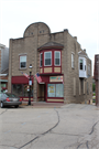 125 S Main St, a Commercial Vernacular small retail building, built in West Bend, Wisconsin in 1907.