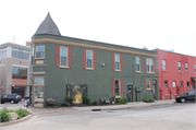 136 S Main St (AKA 135 5th Ave), a Queen Anne retail building, built in West Bend, Wisconsin in 1898.