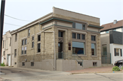 519 Hickory St, a Commercial Vernacular small office building, built in West Bend, Wisconsin in 1908.