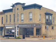 121-123 W MILWAUKEE ST, a Italianate retail building, built in Janesville, Wisconsin in 1869.