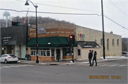 121 N CASCADE ST (AKA 102 2ND AVE), a Commercial Vernacular small retail building, built in Osceola, Wisconsin in 1904.