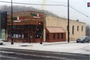 121 N CASCADE ST (AKA 102 2ND AVE), a Commercial Vernacular small retail building, built in Osceola, Wisconsin in 1904.