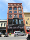 116 S 4TH ST, a Romanesque Revival large retail building, built in La Crosse, Wisconsin in 1884.