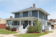 714 HURON ST, a American Foursquare house, built in Manitowoc, Wisconsin in 1917.