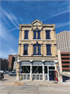 320 E CLYBOURN AVE, a Italianate large retail building, built in Milwaukee, Wisconsin in 1874.