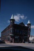 1821 HALL AVE, a Queen Anne retail building, built in Marinette, Wisconsin in 1890.