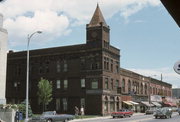 1916 HALL AVE, a Romanesque Revival small office building, built in Marinette, Wisconsin in 1885.