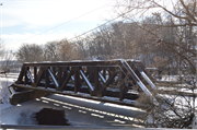 RR over Menomonee River, E of Harwood Ave., a NA (unknown or not a building) pony truss bridge, built in Wauwatosa, Wisconsin in 1909.
