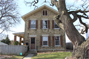8447 W LISBON AVE, a Greek Revival house, built in Milwaukee, Wisconsin in 1875.
