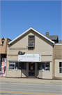 1112 WASHINGTON ST, a Front Gabled small retail building, built in Manitowoc, Wisconsin in 1867.