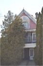 1409 - 1409A WASHINGTON ST, a Queen Anne duplex/two-flat, built in Manitowoc, Wisconsin in 1911.
