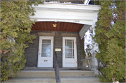 1409 - 1409A WASHINGTON ST, a Queen Anne duplex/two-flat, built in Manitowoc, Wisconsin in 1911.