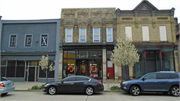 711-713 S 5TH ST, a Romanesque Revival small retail building, built in Milwaukee, Wisconsin in 1888.