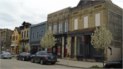 711-713 S 5TH ST, a Romanesque Revival small retail building, built in Milwaukee, Wisconsin in 1888.