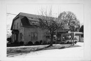 2157 RIVERSIDE AVE, a Dutch Colonial Revival small office building, built in Marinette, Wisconsin in 1888.