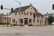 101 N MILL ST, a Greek Revival retail building, built in Saukville, Wisconsin in 1867.