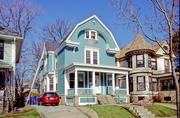 2753 N HACKETT AVE, a Dutch Colonial Revival house, built in Milwaukee, Wisconsin in 1895.