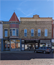 7-9 W MAIN ST, a Commercial Vernacular small retail building, built in Evansville, Wisconsin in 1897.