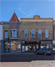 7-9 W MAIN ST, a Commercial Vernacular retail building, built in Evansville, Wisconsin in 1897.