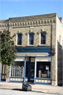 323 STEELE ST, a Italianate small retail building, built in Algoma, Wisconsin in 1881.