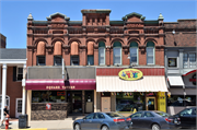 120-124 4TH AVE, a Romanesque Revival retail building, built in Baraboo, Wisconsin in 1886.